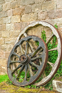 Old Wooden Wheels by Old Stone Wall