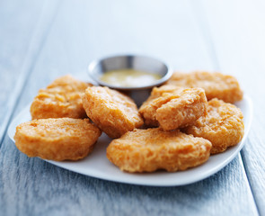 chicken nuggets with honey mustard in natural light