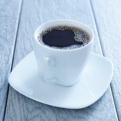 cup of hot coffee on saucer