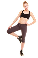 Obraz na płótnie Canvas sport. fitness sporty blonde girl stretching leg isolated