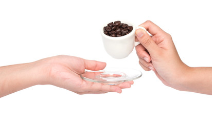 female hand hold cup of coffee beans isolated on white backgroun