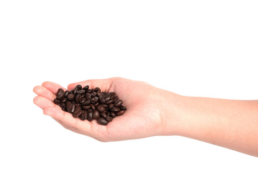 Coffee bean on female hand isolated on white background
