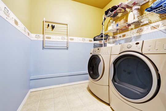 Laundry room interior in light blue and yellow colors