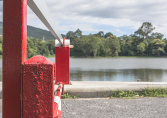 red Barrier Gate with mountain and lake  background