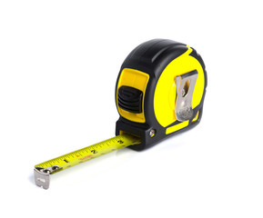 Yellow measure building tool with pencil on white background.