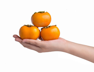 Hand holding ripe persimmon isolated on a white background - 68460319