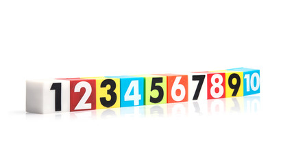 Colorful plastic numbers on a white background