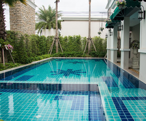 Residential swimming pool in backyard