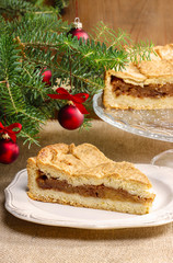 Apple pie in christmas setting. Cake on wooden table,