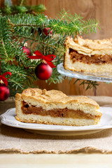 Apple pie in christmas setting. Cake on wooden table,