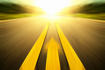 Yellow arrow Line exceeding on the road. - obrazy, fototapety, plakaty