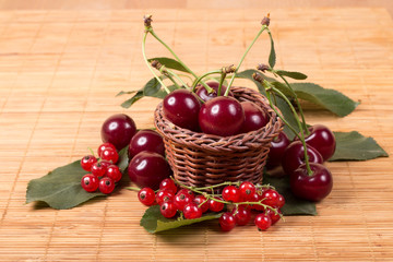 Fototapeta na wymiar ripe cherry on a wooden table, food close up 