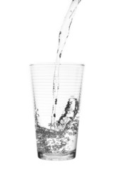 water splashing from curly glass isolated on white background.