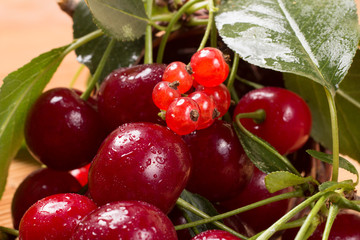 ripe cherry on a wooden table, food close up 