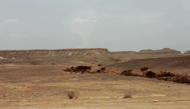 An Egyptian Desert And Mysty Sky in the daylight