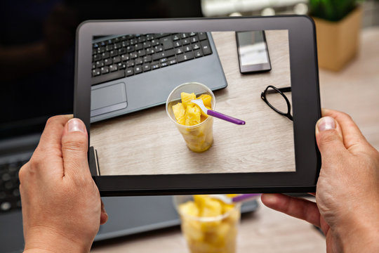 Picturing Fruit Lunch Box At Office Using Digital Tablet