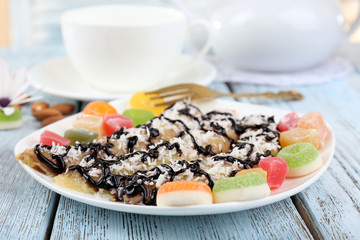 Sweetened fried banana on plate, close-up