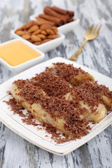 Sweetened fried banana on plate, close-up