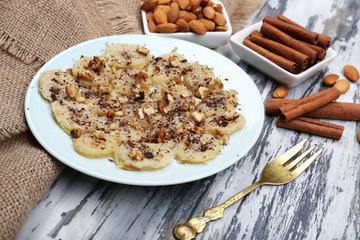 Sweetened fried banana on plate, close-up
