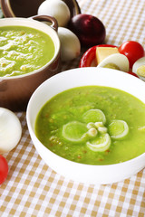 Leek soup on table, close up