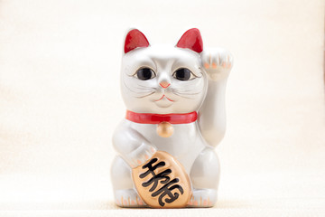 Japanese beckoning cat also known as maneki neko