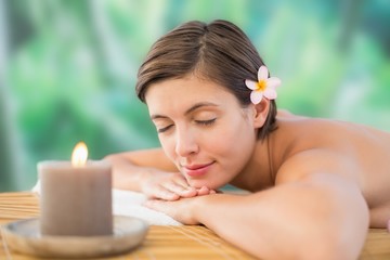 Obraz na płótnie Canvas Close up of a beautiful woman on massage table