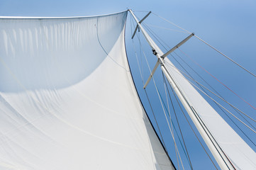 Big white sail hoisted - obrazy, fototapety, plakaty