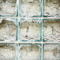 Old wall made of broken glass bricks