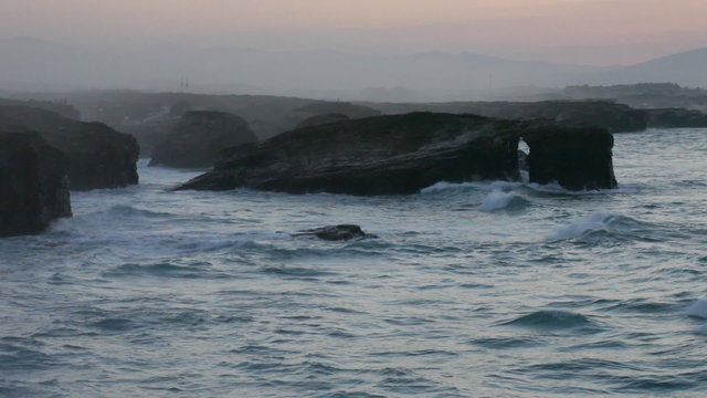 Storming waves during inflow at sunset on Playa de las Catedrale