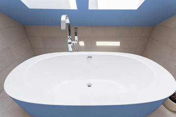 Blue bathtub in bathroom