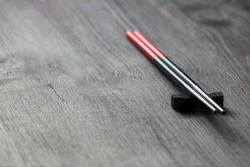 Two chopsticks on sushi mat background