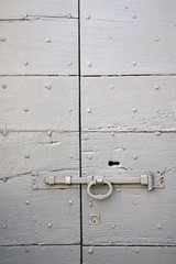 villadosia  knocker in a  door curch  lombardy italy