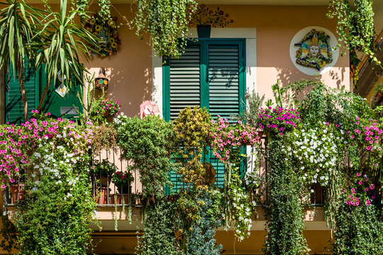 Traditional Italian House Decorated By Flowers