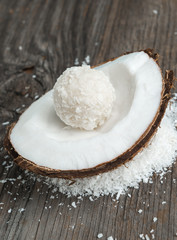 Coconut cake balls wooden background