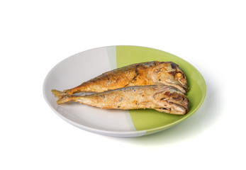 fried fish on white and green plate.