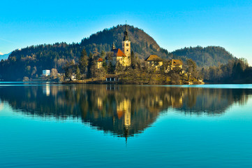 Fototapeta na wymiar St. Martin Church on Island in Lake Bled with Mountains