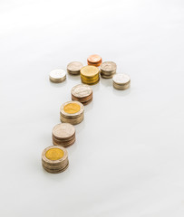Arrow made out of thai coins isolated