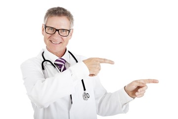 Friendly smiling doctor pointing to the right