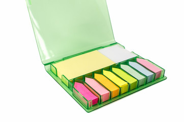 The set of colorful sticky note paper in a box isolated