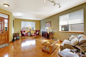 Living room with antique burgundy chairs