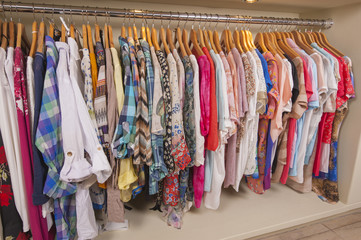 Womens clothes hanging on rail