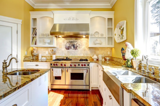 Bright Yellow Kitchen Room With Granite Tops