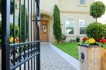 Entrance wrought iron gate to luxury house