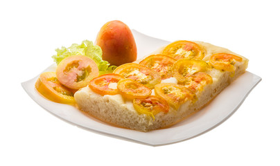 Pizza with sliced tomato