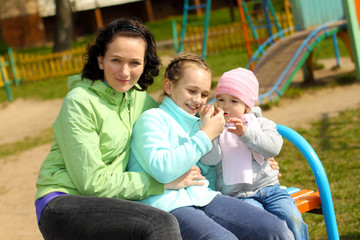 Two daughters and mother emotionally and fun cuddling