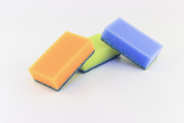 Three sponges for washing dishes on white background