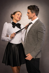 Happy Lovely Couple in Trendy Attire Isolated Gray