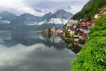Naklejka premium Hallstatt village in Alps at misty day, Austria