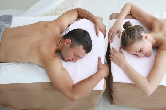 Young couple having spa procedure togerther