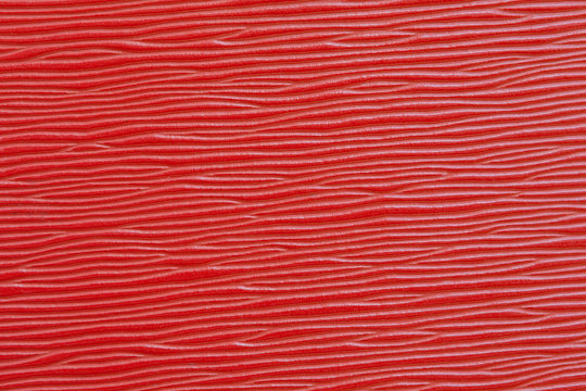 Red plastic plate background wood texture